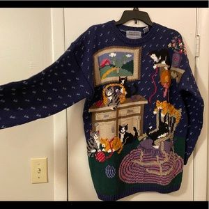 Handling kitten sweater